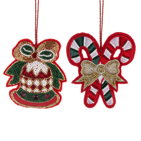 Two red beaded ornaments. One is shaped like a bell and the other like candy canes.