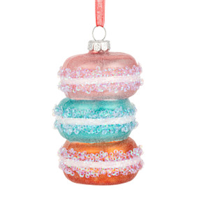An ornament shaped like a stack of three macarons in pink, blue and orange.