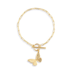 A gold chain bracelet with a toggle clasp and a gold butterfly charm.