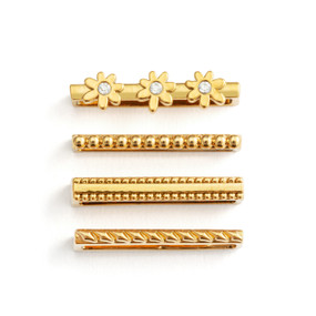 Four different gold charms that fit on a smart watch band. One has three daisy charms.