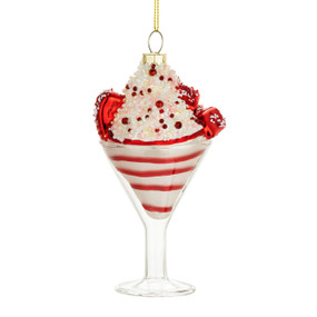 A hanging ornament shaped like a peppermint martini in a clear glass.