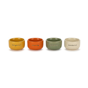 A set of four small ceramic pinch bowls in different orange and green colors. Each has a different word on the front including delightful, amazing, splendid and wonderful.