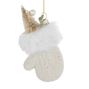 A sparkly white mitten filled with a decorated gold tree.