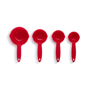 A set of four red melamine measuring cups.