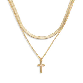 A layered gold necklace with a gold cross charm.