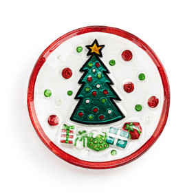 A mini round glass plate with a Christmas tree, gifts and a red rim.