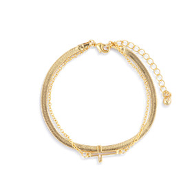 An adjustable layered gold bracelet with a gold cross charm.