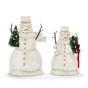 Two different cream paper pulp snowmen holding a wreath and small green tree.
