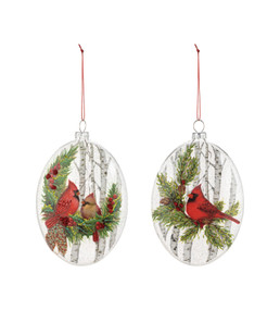 Two different oval ornaments with painted images of cardinals in birch trees.
