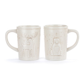 A set of two white ceramic mugs. One has a winter deer and the other has a polar bear sculpted into the mug.