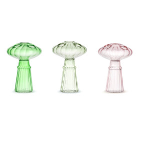 Three small pale glass mushroom shaped arranging vases with holes in the top.