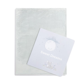 A gift set including a light blue blanket and a gift book with the title "Sweet Dreams".
