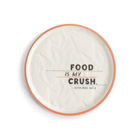 A white crinkly melamine plate with a peach rim. The saying "Food is my Crush" is on the right.