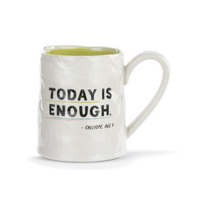 A white ceramic mug with a crinkly appearance. The interior is light green and the saying "Today is enough" is on the front.