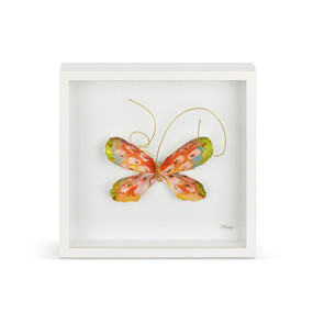 An orange butterfly with gold wire tentacles in a white square framed wall art.