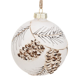 A white round ornament with painted pinecones and branches.