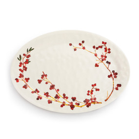 A white oval melamine platter with an illustration of cranberry branches.