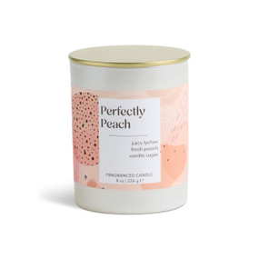 An 8 oz perfectly peach scented candle in a round white container with a gold lid.