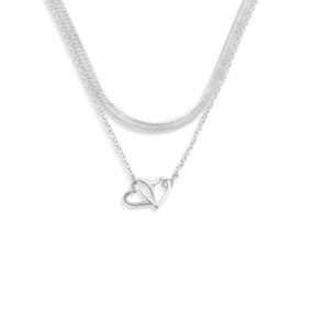 A layered silver necklace with a silver charm of interlocking hearts.