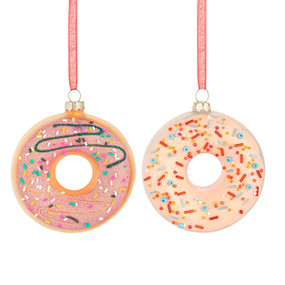 Two different round donut ornaments decorated with frosting and sprinkle decorations.