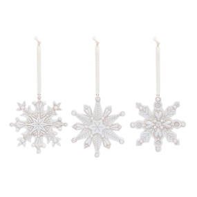 Three different white paper pulp snowflake ornaments.