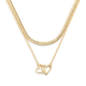 A layered gold necklace with a gold charm of interlocking hearts.