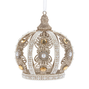 An ornately decorated crown shaped ornament decorated with beads, stones and gold glitter.