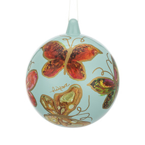 A mint green round ornament with illustrated red and brown butterflies all over.