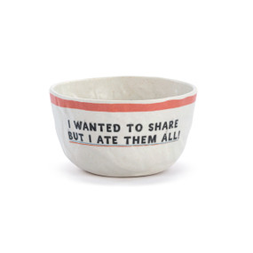 A white crinkly melamine bowl with a peach rim and the saying "I wanted to share but I ate them all!".