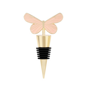 A gold bottle stopper with a pink and gold butterfly at the top.