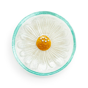A mini round glass plate with a daisy flower and a light green rim.
