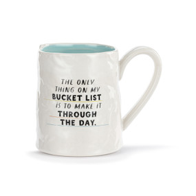 A white ceramic mug with a crinkly appearance. The interior is light blue and the saying "The only thing on my bucket list is to make it through the day" is on the front.