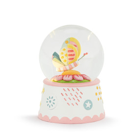 A water globe on a white base with pastel accents. The globe lights up and has a patchwork pastel butterfly sitting on a pink flower.