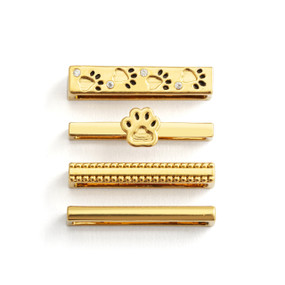 Four different gold charms that fit on a smart watch band. Two have different paw prints.