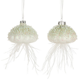 Two white and light green jelly fish shaped ornaments. Each is decorated on top with small white beads and has white feathers coming down as tendrils.