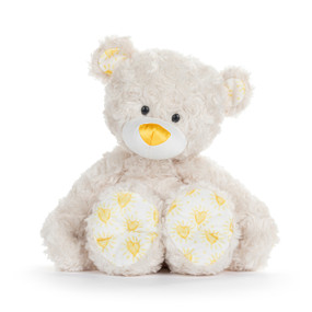A cream plush teddy bear with a bright yellow nose and sunshine hearts on its paws and ears.