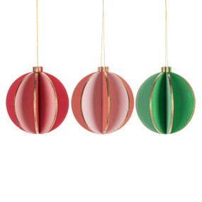 Three round wood ornaments in coral, pink and green with gold on their edges.