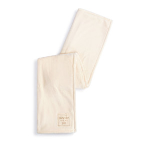 A cream throw blanket with a fabric patch that says "Warm and Cozy Comfort and Joy" displayed folded over itself.