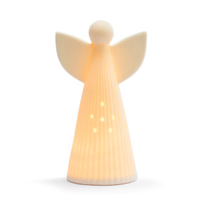 A large white ceramic angel figure displayed lit up.