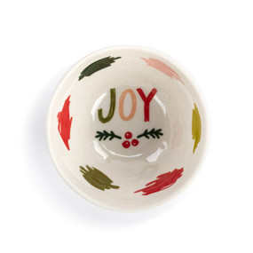 Top down view of a white dip bowl with illustrated colorful scribbles and the word Joy on the inside.