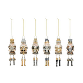 A set of six different blown glass Nutcracker ornaments. They are all decorated with sparkle.