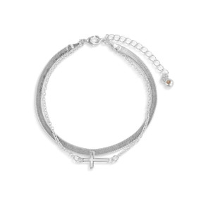 An adjustable layered silver bracelet with a silver cross charm.