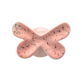 A pink ceramic butterfly shaped wall hook speckled with gold.