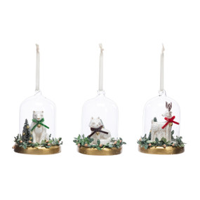 Three different cloche ornaments each with a different white animal inside. Animals include a polar bear, deer and fox.