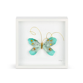 A turquoise and gold butterfly with gold wire tentacles in a white square framed wall art.