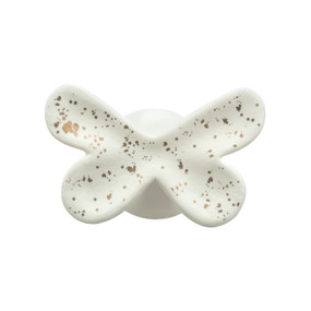 A white ceramic butterfly shaped wall hook speckled with gold.