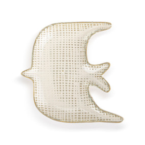 A tan textured small dish shaped like a dove.