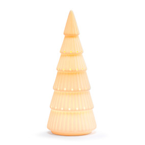 A large evergreen tree shaped white ceramic figure that lights up, displayed lit.