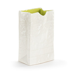 A small white ceramic vase that looks like a crinkly paper bag with a light green interior.
