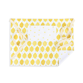 A yellow and white half apron with a lemon pattern on the front along with a pocket and cream ties.